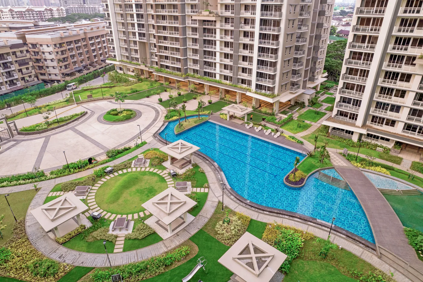 Aerial view of the lagoon pool and towers at Alder Residences, Acacia Estates, Taguig