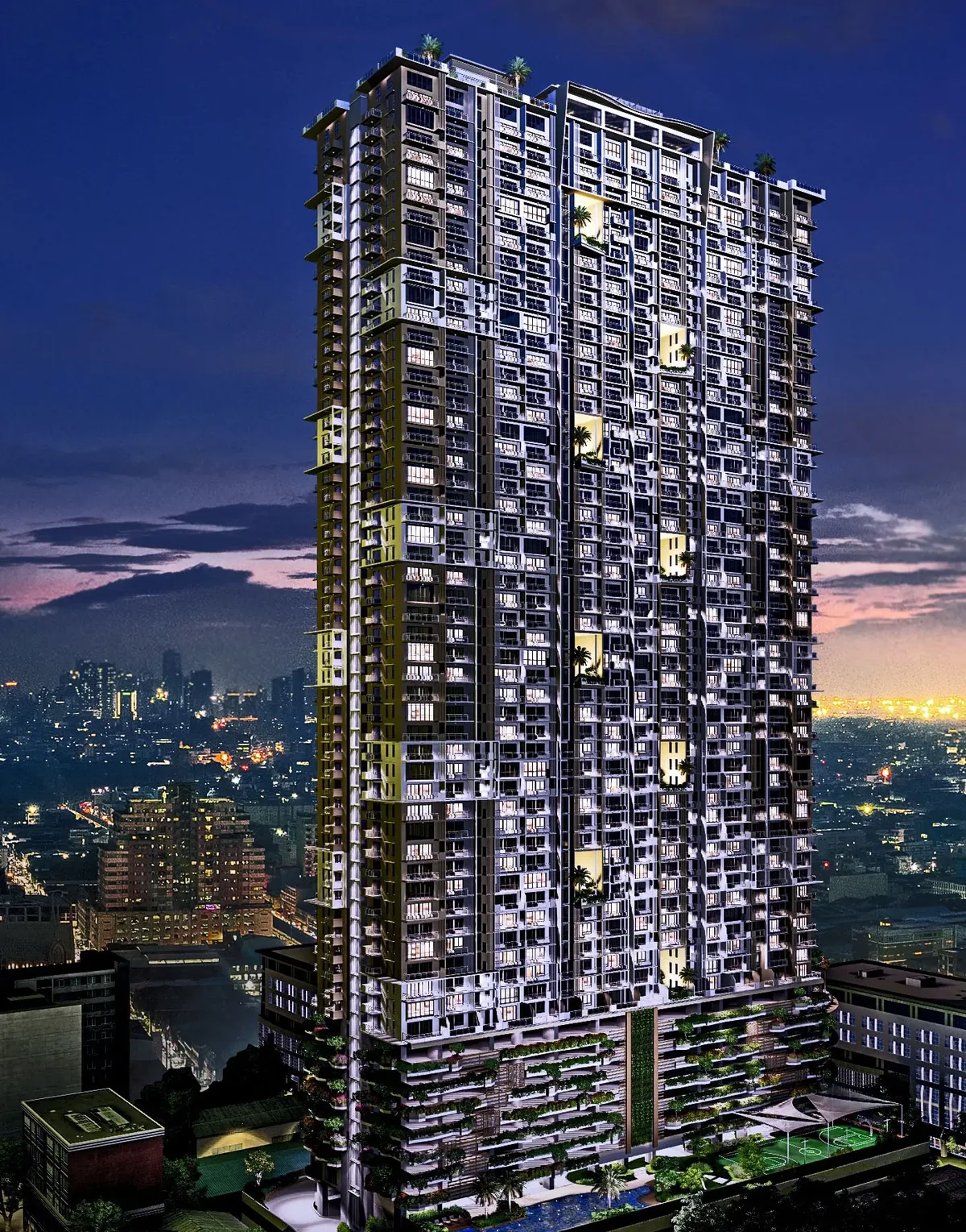 The Calinea Tower seen from the air at dusk, showing the 48-storey tower above its ten-level parking podium in Caloocan City