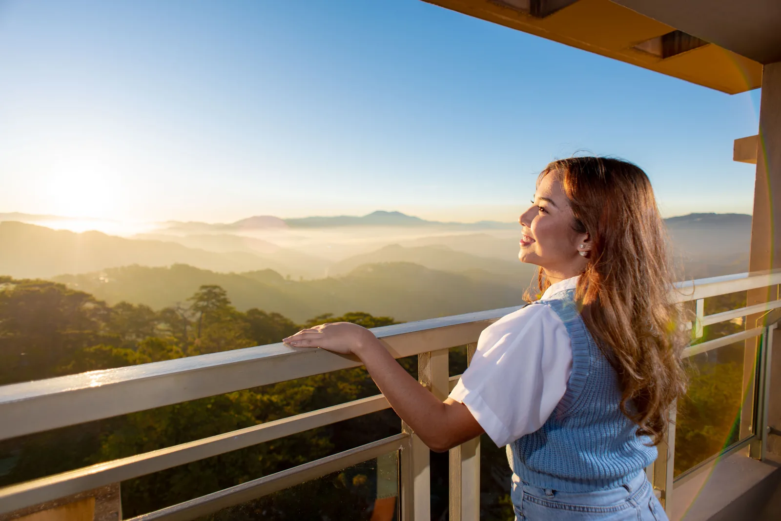 Sunrise over the Benguet mountains from a balcony at Moncello Crest