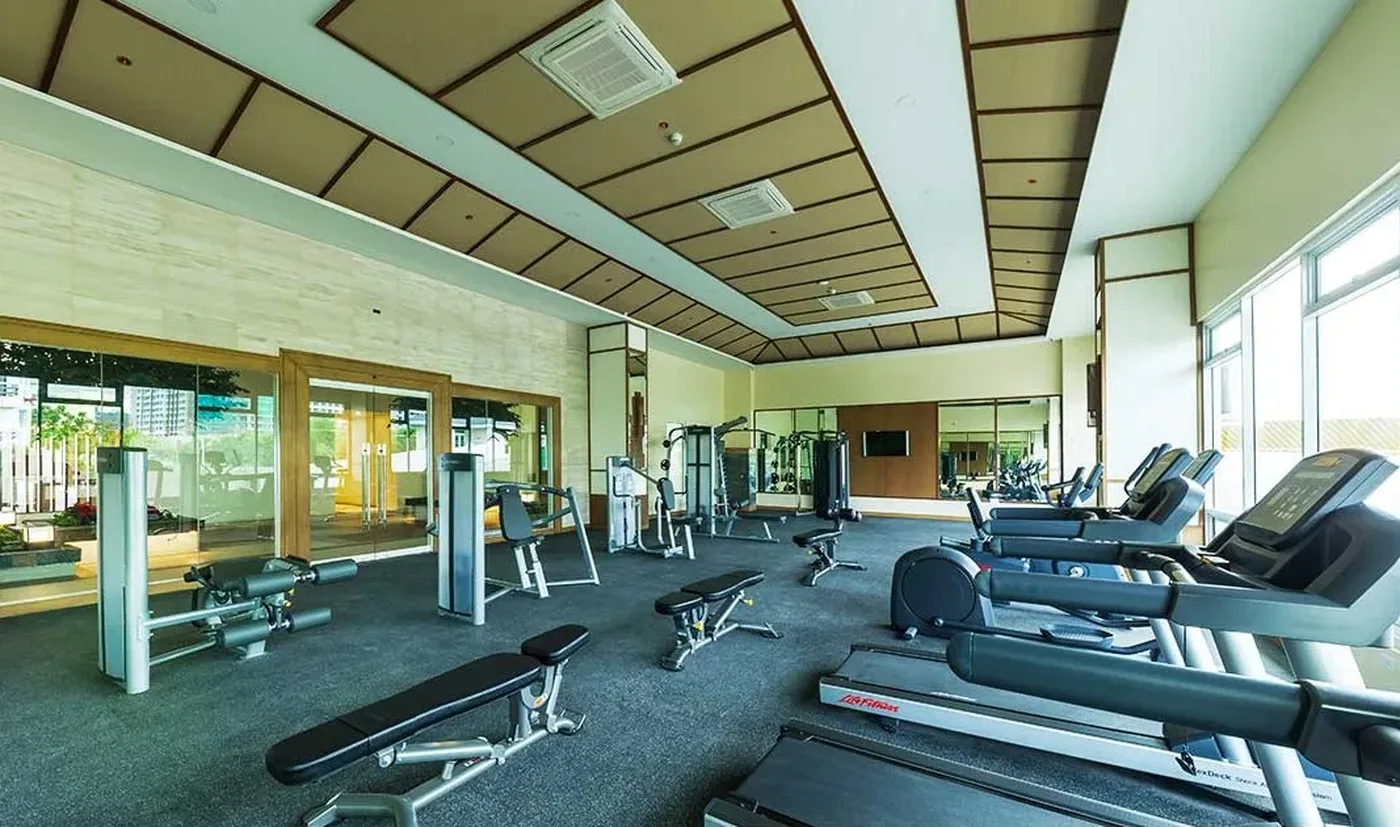 Fitness gym with bay-facing windows at Oak Harbor Residences
