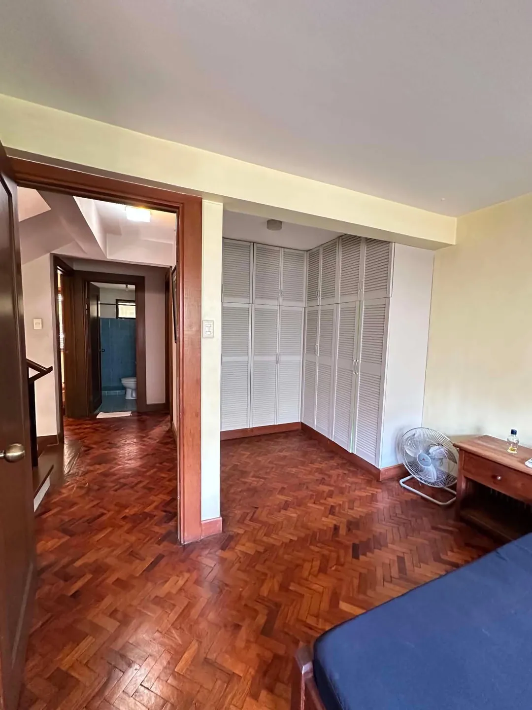 Bedroom built-in wardrobe and doorway to the bathroom, Mahogany Place 3