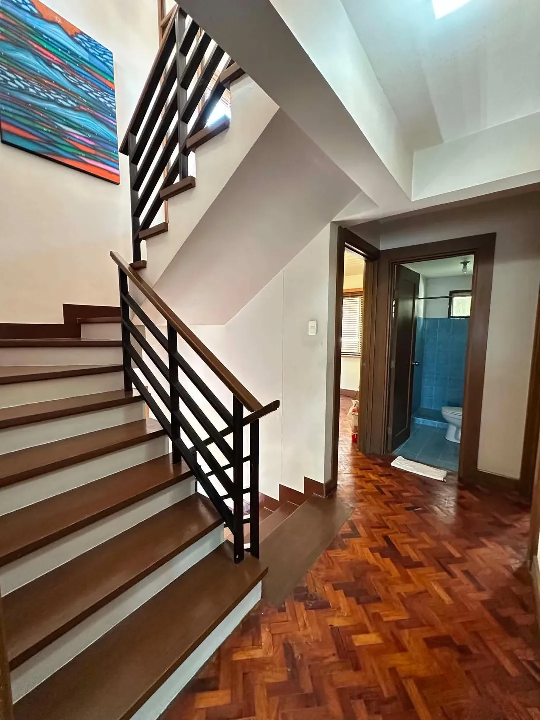Timber staircase and parquet hallway, Mahogany Place 3 house